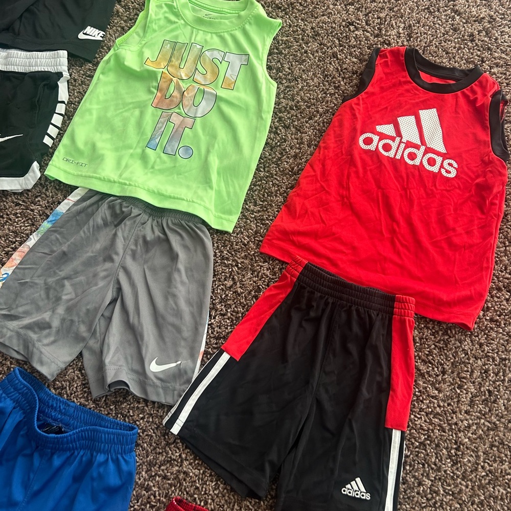 10 shorts. 2 outfits. 3 tank tops. 2 under armor button shorts.